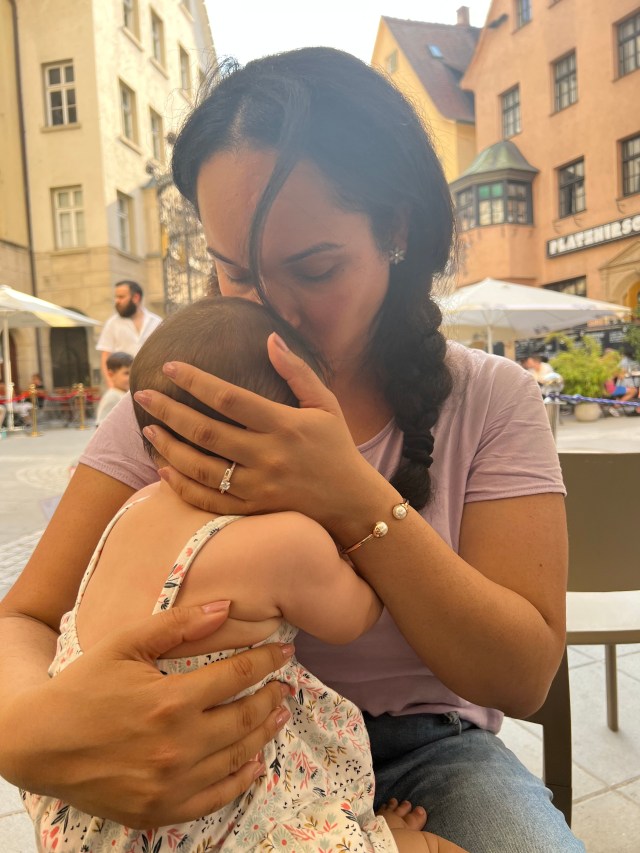 Mother and father celebrating child's first birthday party.